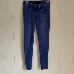 Size 1. Mid rise ankle skinny jeans medium washed out blue color.